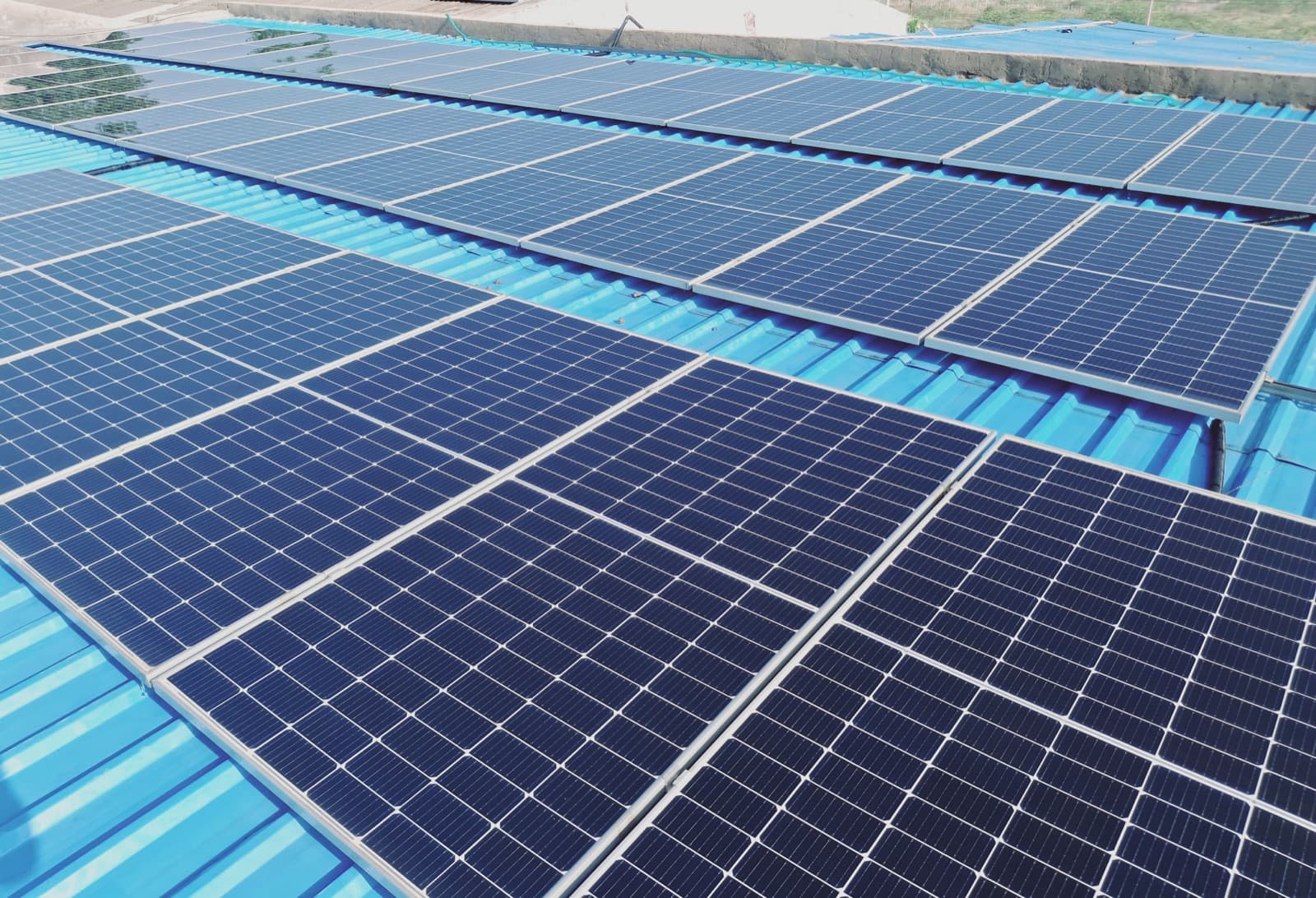 Solar panels installed across the factory rooftop