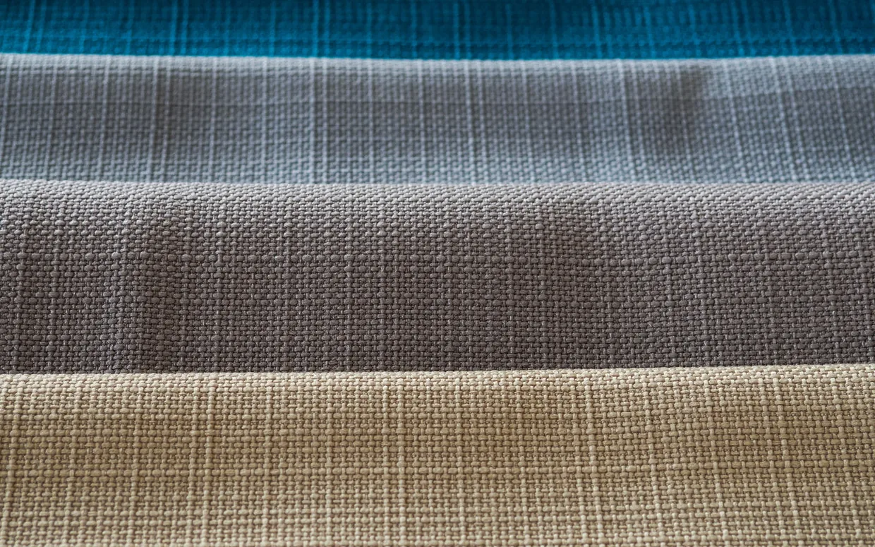 School uniform fabric in checked and plain shades laid out together