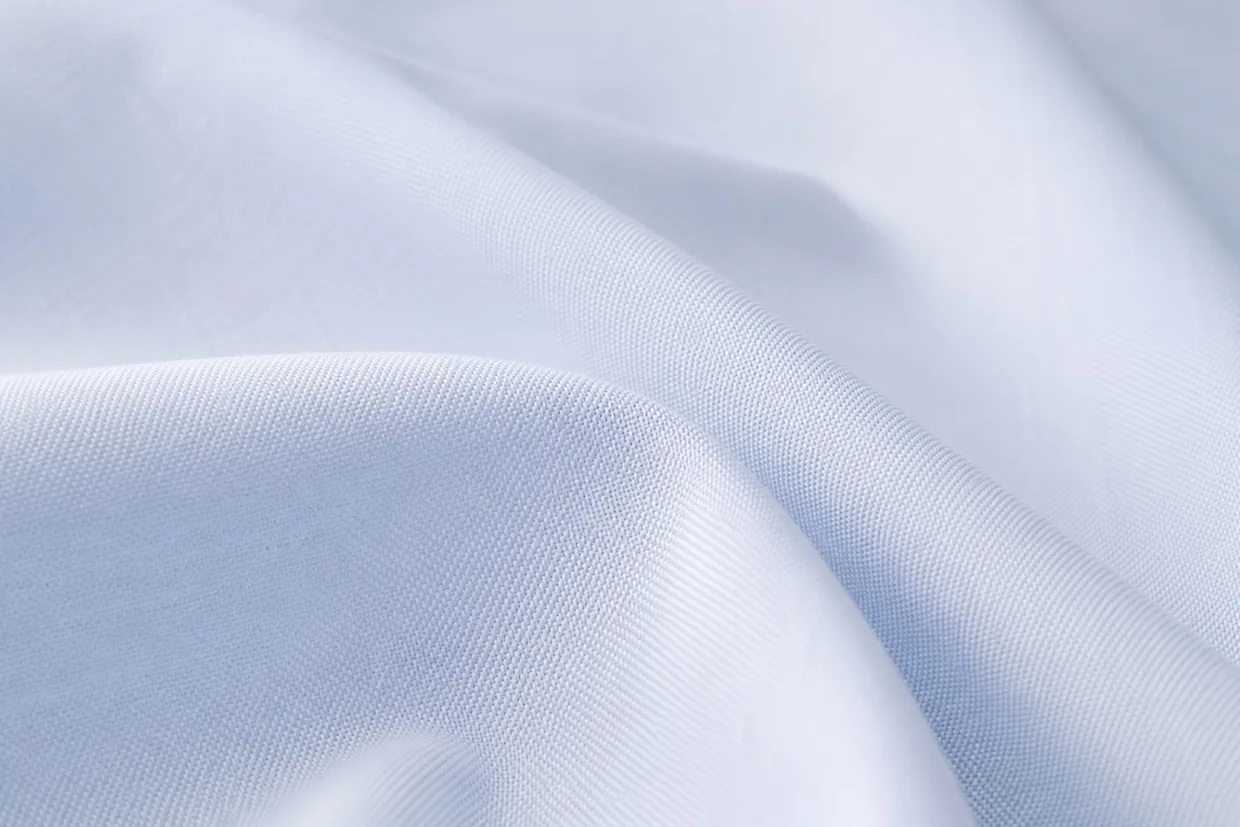Pale blue corporate shirting fabric close-up