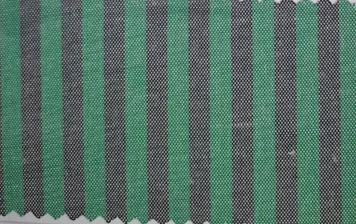Close-up of green and black striped hospital staff uniform fabric