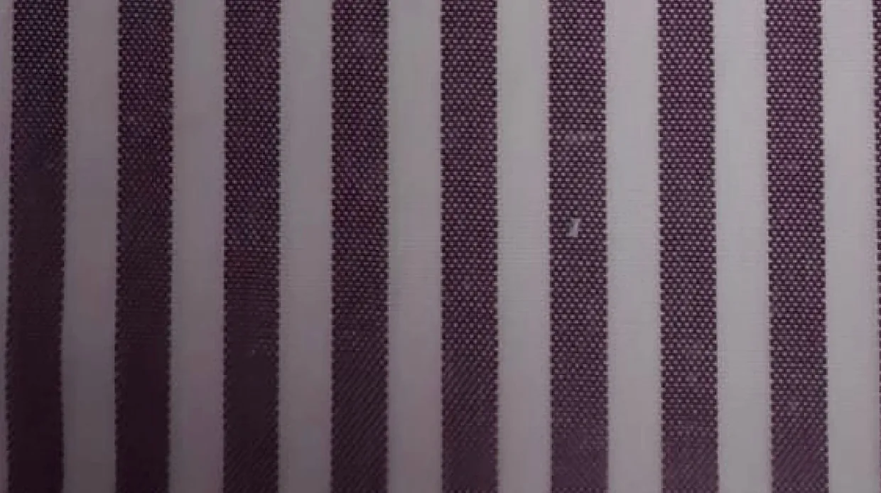 Close-up of green and black striped hospital staff uniform fabric